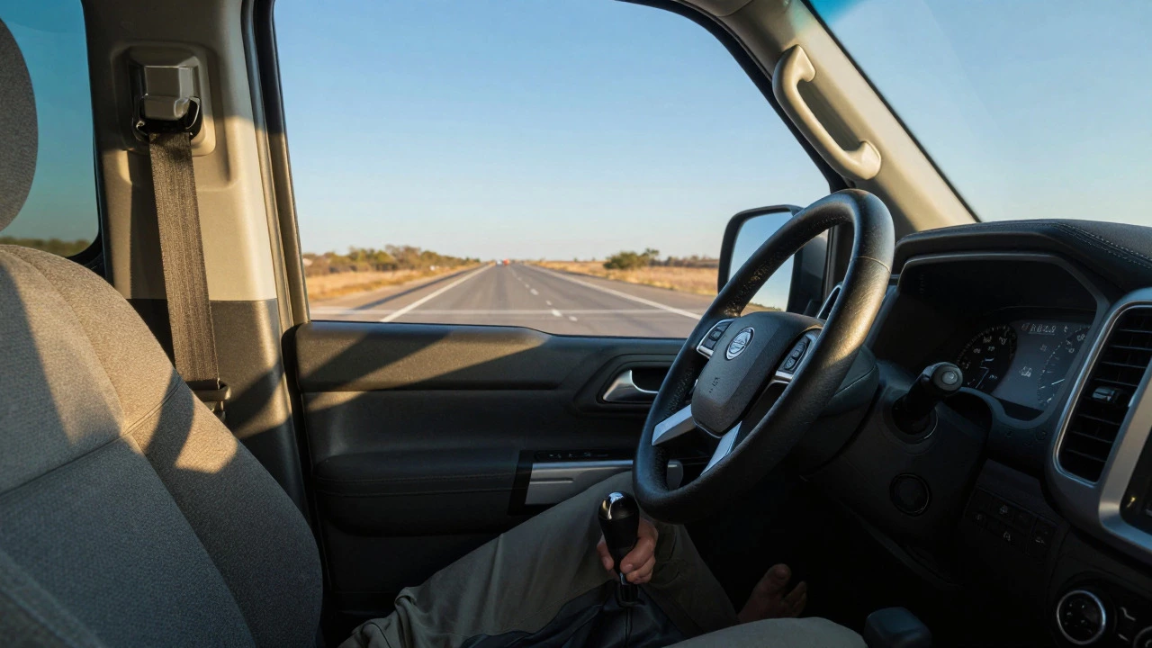 Driver shifting gears in a diesel truck on a sunny highway, illustrating efficient long-distance driving.